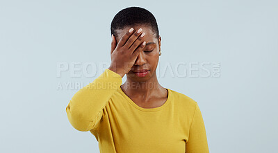 Buy stock photo Frustrated black woman, headache and stress in mistake, fail or loss against a gray studio background. Face of tired African female person or model with migraine in disappointment, burnout or fatigue