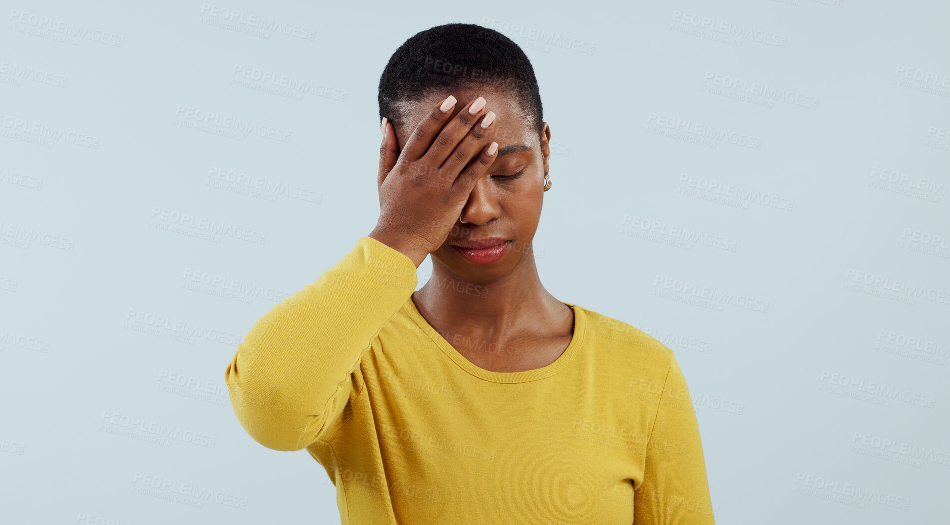 Buy stock photo Frustrated black woman, headache and stress in mistake, fail or loss against a gray studio background. Face of tired African female person or model with migraine in disappointment, burnout or fatigue