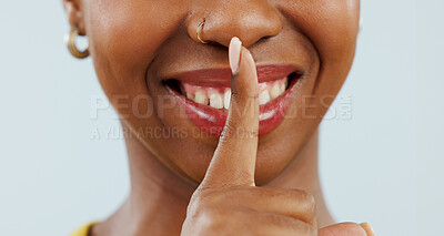 Buy stock photo Black woman with secret, finger on mouth and smile for news, announcement or offer with gossip in studio. Whisper, silence or happy person with hand on lips for confidential info on white background