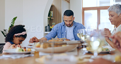 Buy stock photo Christian, family and praying at dinner in home with gratitude, thanks and praise for God. People, pray and together giving spiritual respect or grace at lunch, table and holding hands in dining room