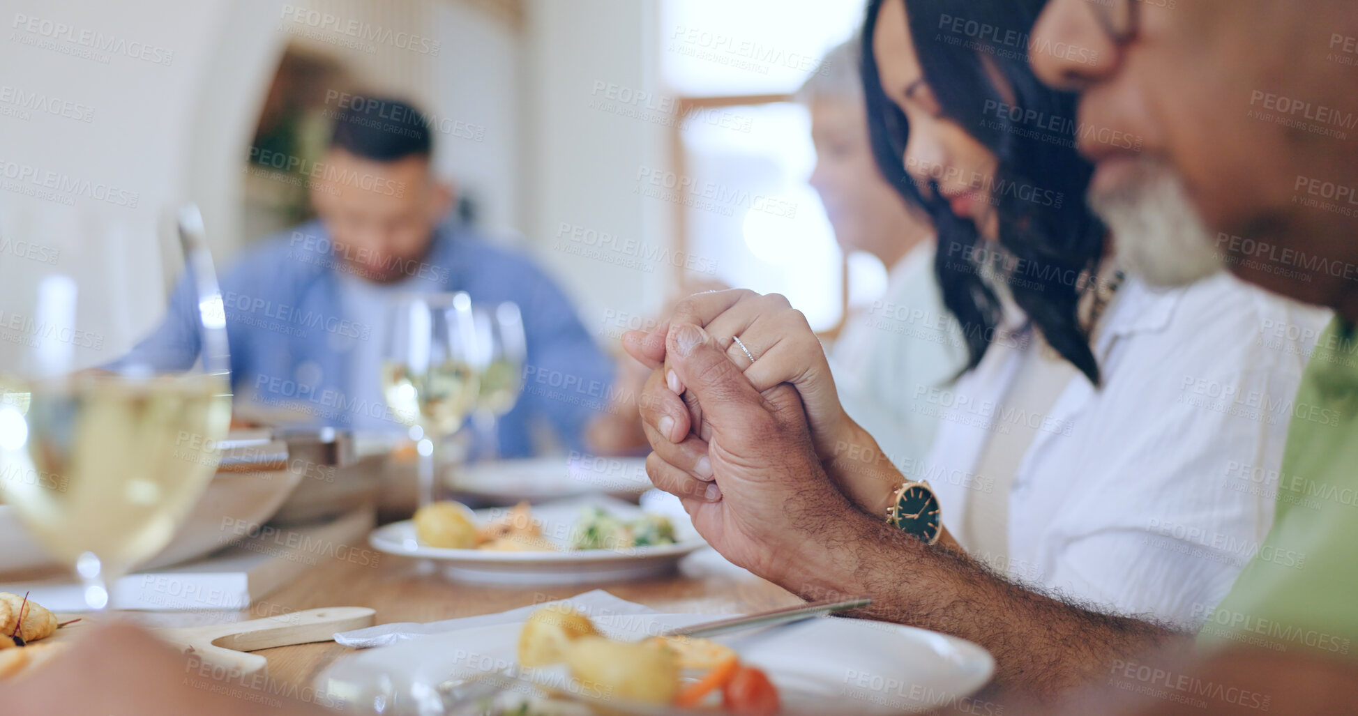 Buy stock photo Home, praying and family with food, lunch and festive celebration with blessing, brunch and thanksgiving. Holding hands, apartment and group of people with religion, ritual and gratitude with worship