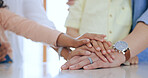 Family, hands together and holding with closeup in home for trust, support and care. Man, woman and kids with pile for unity, community or collaboration on table in kitchen with generation for future