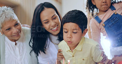 Buy stock photo Birthday cake, child blowing candles and big family to celebrate with smile, fun and love together in home. Happiness, boy and congratulations, mom and grandparents at kids party with excited people.