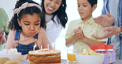 Buy stock photo Child with cake, candles and big family for birthday celebration with smile, fun and love together in home. Happiness, gift and congratulations, parents and and kids at party with excited children.