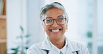 Woman, portrait and hospital doctor with smile for healthcare services, clinic consulting and help. Face of mature surgeon, expert therapist and medical professional with trust, glasses or experience