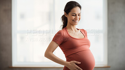 Pregnant, woman and mother touching or caressing her belly while relaxing at home. Expecting, mom to be and cropped of a female rubbing her stomach and preparing for motherhood and childbirth