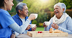 Caregiver, laughing or senior people with coffee for bonding or talking in park or nature to relax. Support, tea drink or happy woman with funny nurse or elderly man speaking of gossip in discussion