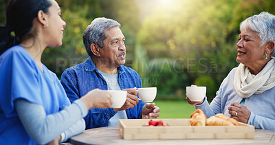 Buy stock photo Nurse, coffee and breakfast for elderly care, retirement or healthcare support at park or nature. Doctor with senior man and woman for tea, meal or outdoor snack together in health and wellness