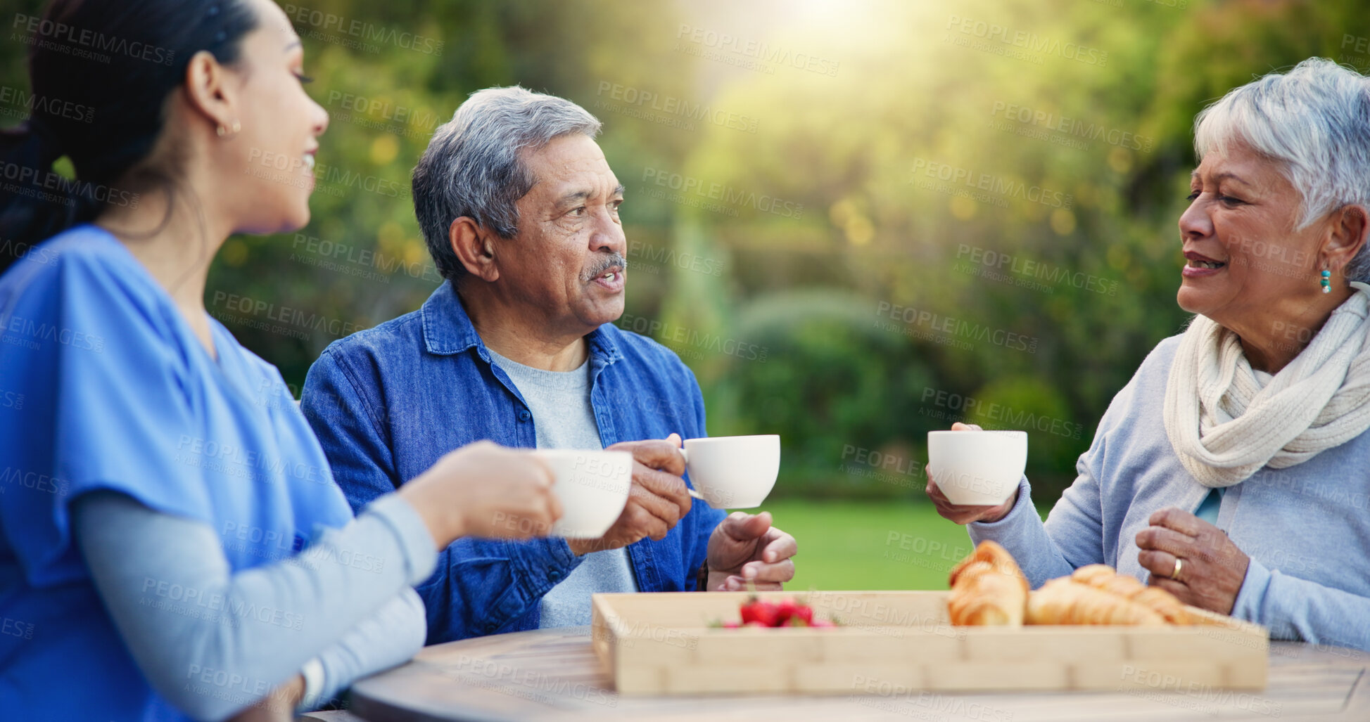 Buy stock photo Nurse, coffee and breakfast for elderly care, retirement or healthcare support at park or nature. Doctor with senior man and woman for tea, meal or outdoor snack together in health and wellness