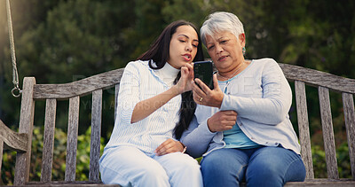 Buy stock photo Phone, senior or mother with woman on bench in nature reading news on social media in retirement. Online gossip, mature parent or daughter for together in park or garden as a family with mobile app