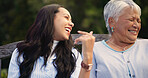 Laughter, senior and mother with daughter on bench, nature and comedy joke for wellness in park. Mature person, happy and woman for together in lounge, bonding and love care with funny chat in garden