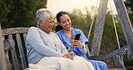 Outdoor, bench and nurse with senior woman, cellphone and connection with social media, conversation and internet. Pensioner, outdoor and caregiver with elderly person, smartphone and typing with app