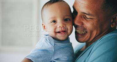 Buy stock photo Happy, love and father hug baby with a smile, support or security in their home together. Family, newborn and face of playful infant with dad in a house for embrace, moment or playing games with care