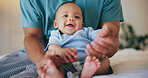 Happy baby, father and bed with cute smile in relax for morning, playing or wakeup at home together. Closeup of parent, dad or little boy and face of adorable new born enjoying bonding in bedroom