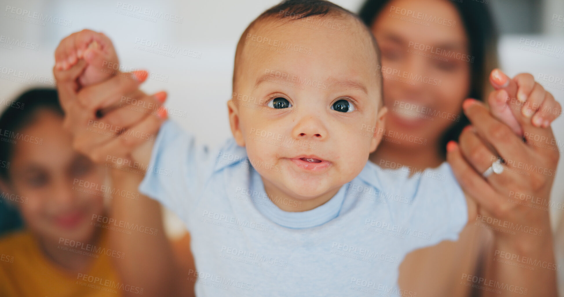 Buy stock photo Portrait, baby and holding hands with a family in the living room of their home together for bonding. Face, cute or adorable with an infant boy, his mother and sister in their apartment closeup