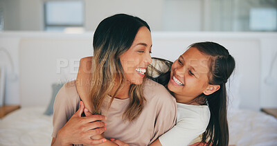 Buy stock photo Face, laughing and a mother hugging her daughter in the bedroom of their home in the morning together. Family, love and funny young girl embracing her single parent while on a bed in their apartment