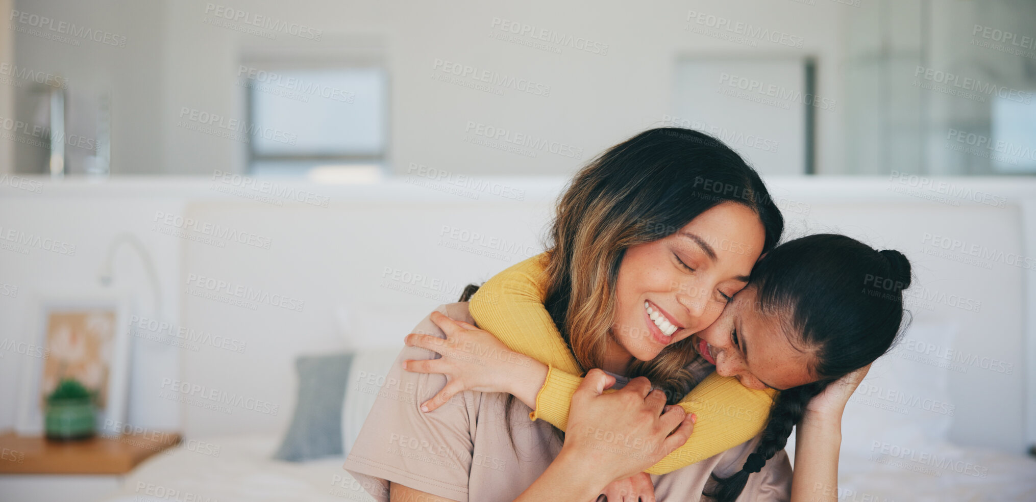 Buy stock photo Love, hug and a mother hugging her daughter in the bedroom of their home in the morning together. Face, smile and a happy young girl embracing her single parent while on a bed in their apartment