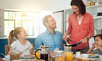 Buy stock photo Food, breakfast and morning with a family in the dining room of their home together for health or nutrition. Mother, father and sibling kids eating at a table in their apartment for love or bonding