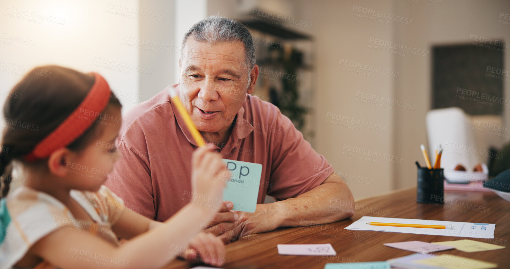 Buy stock photo Happy grandfather, little girl and learning to read and write for literature, education or bonding together at home. Grandparent with child or kid at homeschool for knowledge, study or class at house