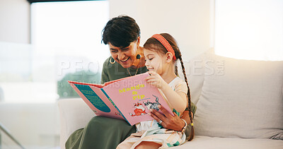 Buy stock photo Happy grandmother, child and reading book on sofa for literature, education or bonding together at home. Grandparent with little girl smile for story, learning or relax on living room couch at house