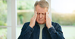 Frustrated senior man, headache and stress in burnout, anxiety or depression at home. Closeup of tired mature male person with migraine, pain or sore head in mental health, mistake or fail at house