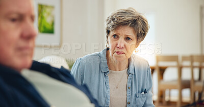 Buy stock photo Senior, couple and stress with conflict and divorce on sofa in living room of home with anger and silence. Elderly, man or woman with fight, upset and frustrated on couch in lounge of house or ignore