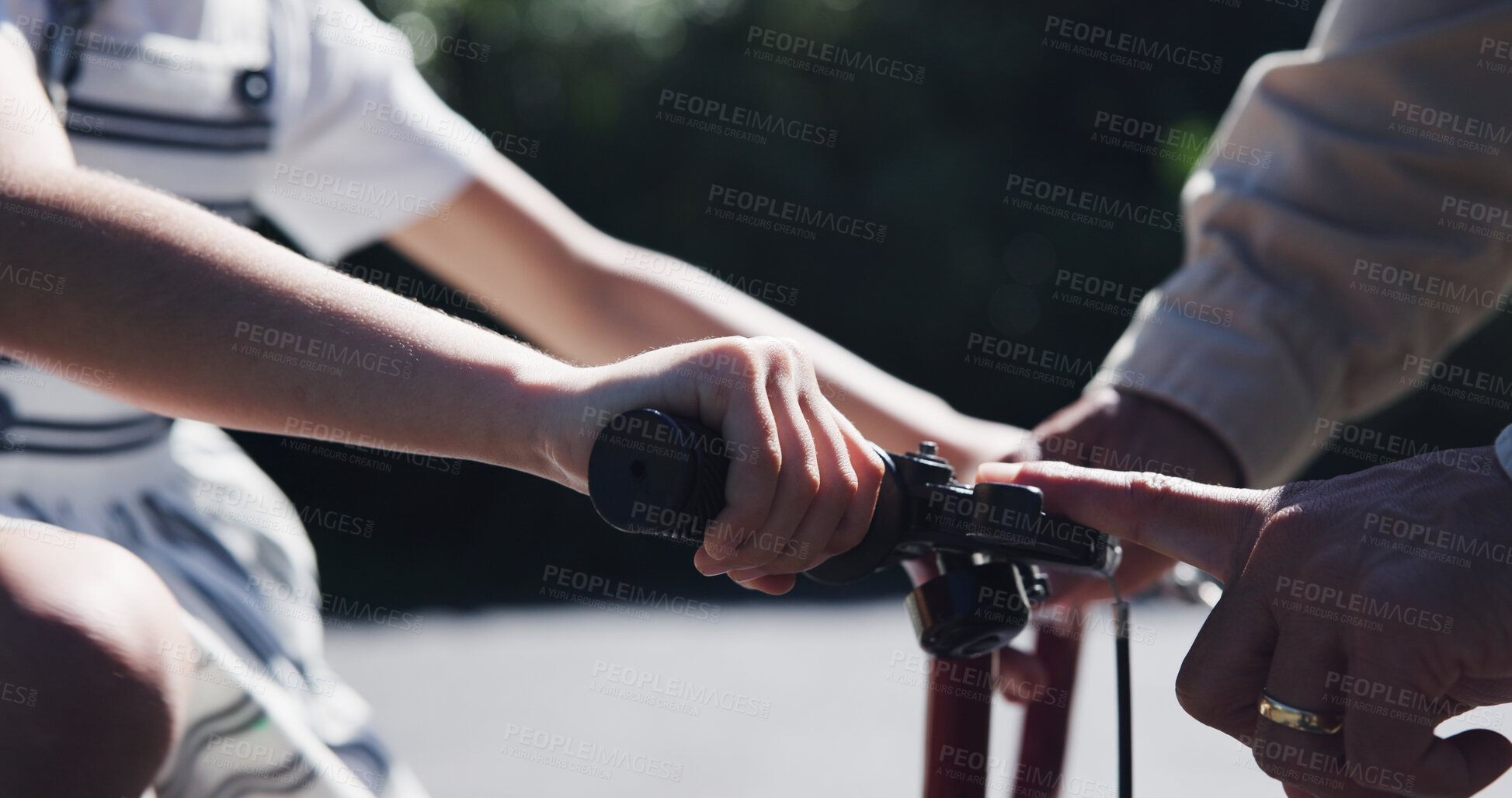 Buy stock photo Parent, child and teaching bicycle ride for safety, closeup and outdoor street with hands. Cycling, childhood memory and riding in summer, bonding together and recreation with bike bell for alert