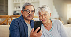 Senior couple, smartphone and video call in living room sofa, conversation and joyful. Grandparents, technology and communication with family, man and woman in retirement, happy and connection

