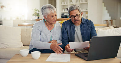 Buy stock photo Elderly, couple and documents for financial planning in home with laptop, internet and reading for account balance. Senior man, woman and discussion with tech, webpage or online banking for budget