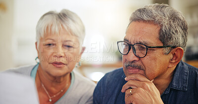 Buy stock photo Senior couple, bills and reading documents in home for budget, planning financial assets and investment. Face of man, woman and thinking of paperwork, taxes or retirement savings for insurance policy