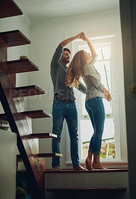 Buy stock photo Love, couple and dancing in home, bonding and having fun together for romance. Dance, happy and man and woman, funny and care, affection and enjoying quality time by stairs to relax on anniversary.