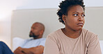 Angry, divorce and black couple in home with conflict, fight or thinking about affair and marriage. African, woman or frustrated in bedroom with stress, problem or depressed from fail in relationship