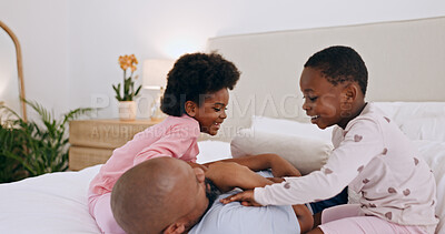 Buy stock photo Bedroom, play and black family father, happy kids or people bonding, love and daughter tickle papa. Home wellness, happiness and African children, dad and parent smile, comfort and fun games on bed