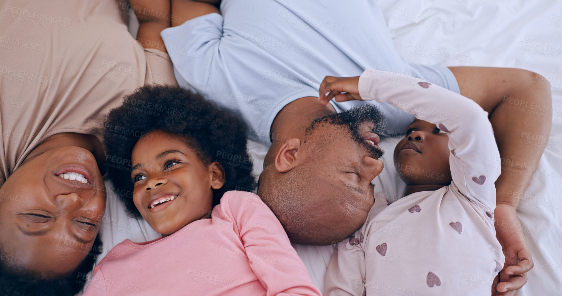 Buy stock photo Top view, bed and funny with black family, smile and happiness with humor, love and bonding together. Parents, mother or father with girls, kids or laugh with joy, children and relax with fun or home