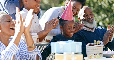 Buy stock photo Child, grandparents or black family in backyard for a happy birthday, celebration or growth together. Smile, clapping or excited African people with cake, love or kids in a fun party, nature or park