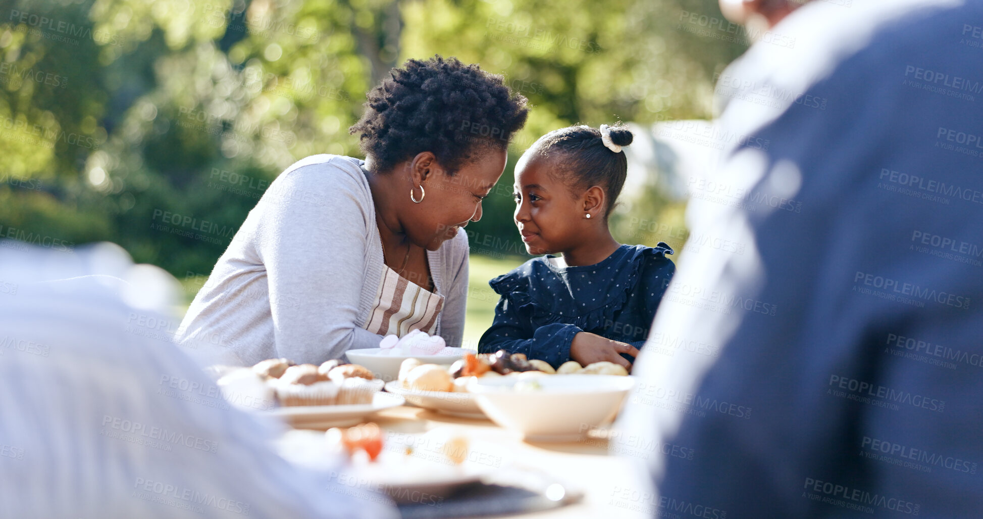 Buy stock photo Smile, mother or daughter with lunch in garden, food or nature relax for vacation together with love. Black people, woman or child as happy family, reunion and care bonding for brunch table in park