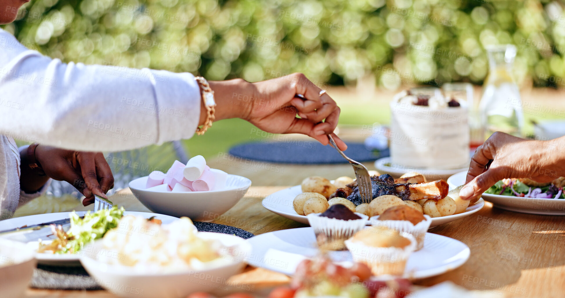 Buy stock photo Hands, food and table for sharing and eating, family together or dinner or social gathering meal at home. Gratitude, love and kindness in bonding on holidays, buffet and for health diet in wellness