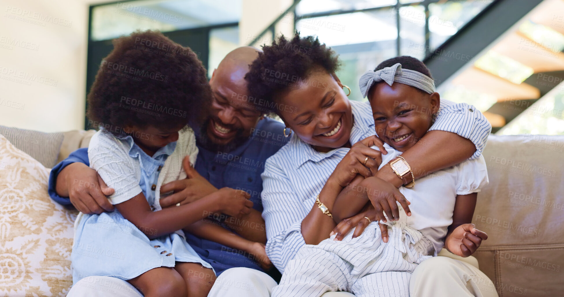 Buy stock photo Happy, black family and hug with love on sofa with children and parents together laughing in home. African, mother and father playing with kids on couch in Nigeria living room with support and care