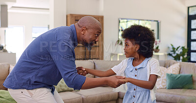 Father, daughter and dancing in living room for holding hands, relax and bonding with music and movement. Black family, man or girl child with having fun, dancer and teaching steps in lounge of house