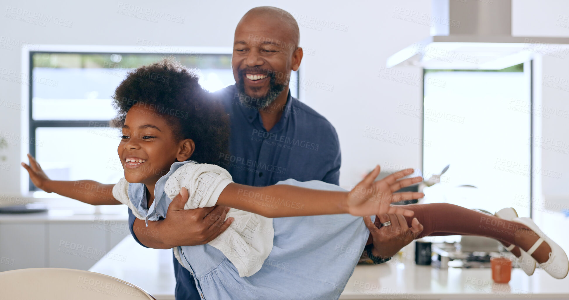 Buy stock photo Child, father and happy with airplane game in kitchen, freedom and fun with love bonding in home. Black family, playing or fantasy flying with arms in air, young daughter or trust together in house 