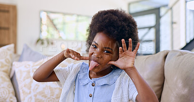 Funny, face and girl child with tongue out on a sofa for fun, playing or goofy personality at home. Crazy, hand gesture and portrait of African kid in living room with comic expression or silly mood