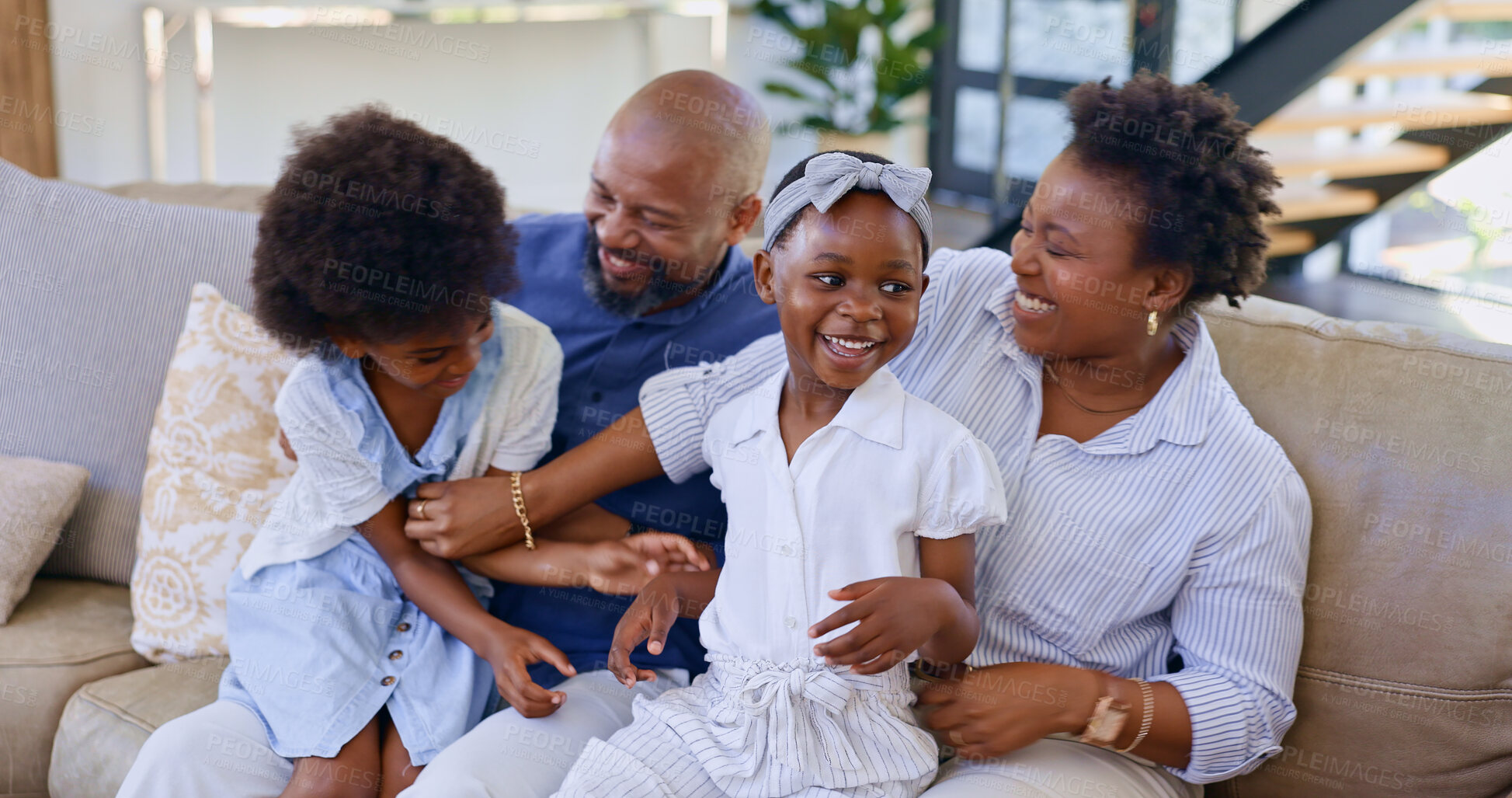 Buy stock photo Happy black family, relax and playing on sofa in living room for bonding, holiday or weekend together at home. African mother, father and children smile for fun break, support or love at house