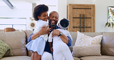 Love, hug and happy black family on a sofa with care, trust and bond at home together. Smile, embrace and excited girl children in a living room with father for support, security or weekend freedom