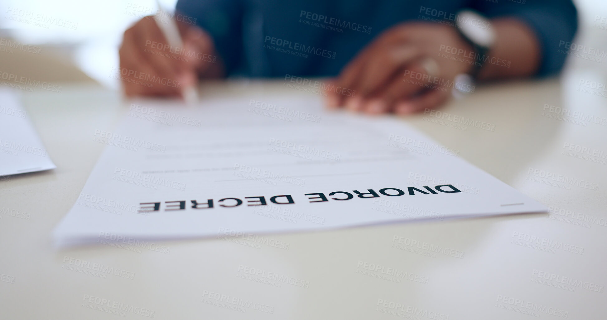 Buy stock photo Signature, contract or document for divorce in home with legal paperwork, notary or decision in closeup. Person, hand and sad for breakup, marriage or conflict in relationship for problem by affair