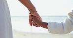 Woman, child or holding hands for love by beach or bonding together for happiness on summer vacation. Commitment, mother or kid in support relationship, holiday or relax wellness by calm ocean




