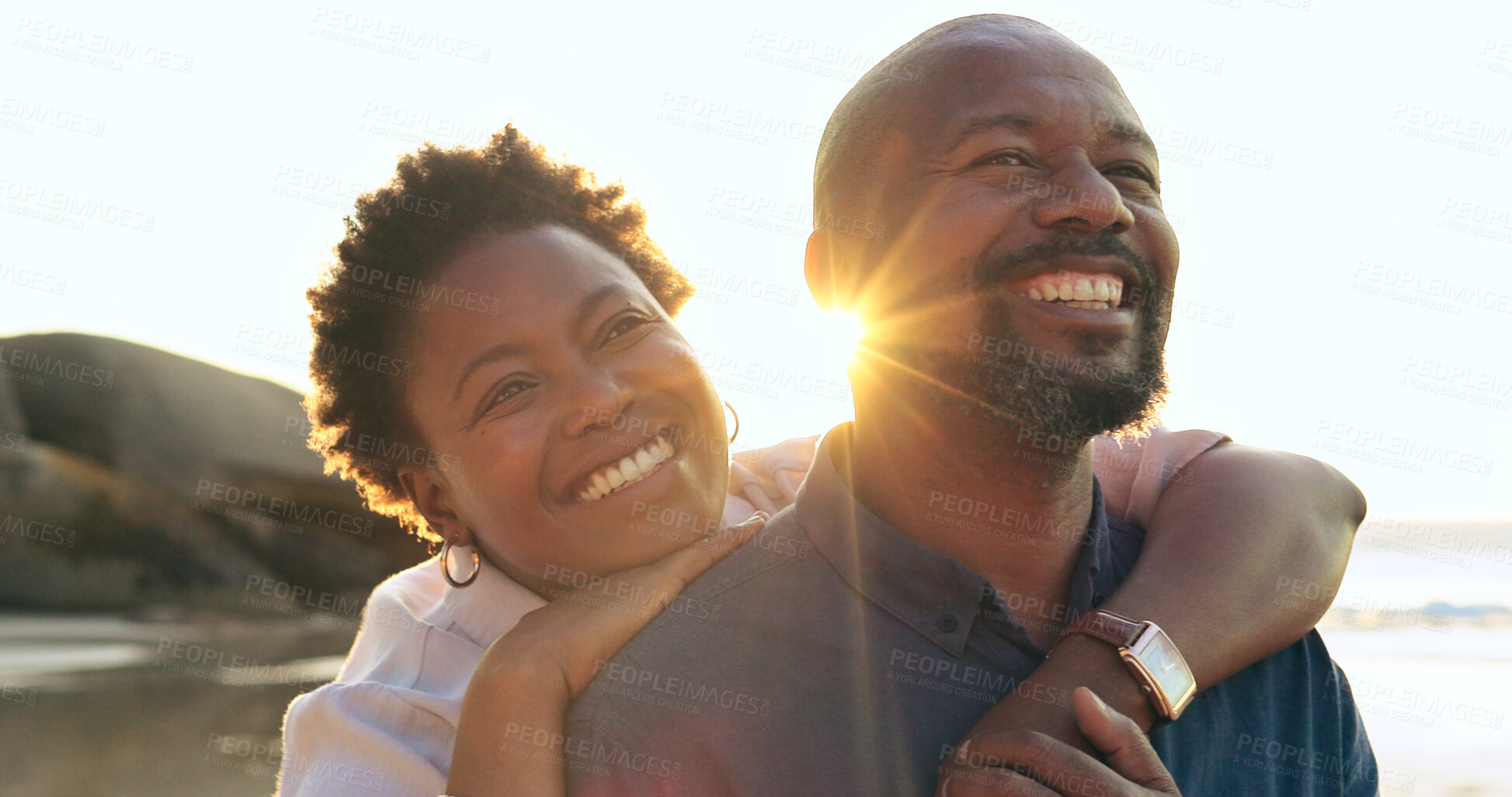 Buy stock photo Couple, hug or smile on beach with love, bonding and sunlight for holiday, vacation and relationship. Black people, man or woman with embrace, happy or romance by ocean or sea for travel or adventure