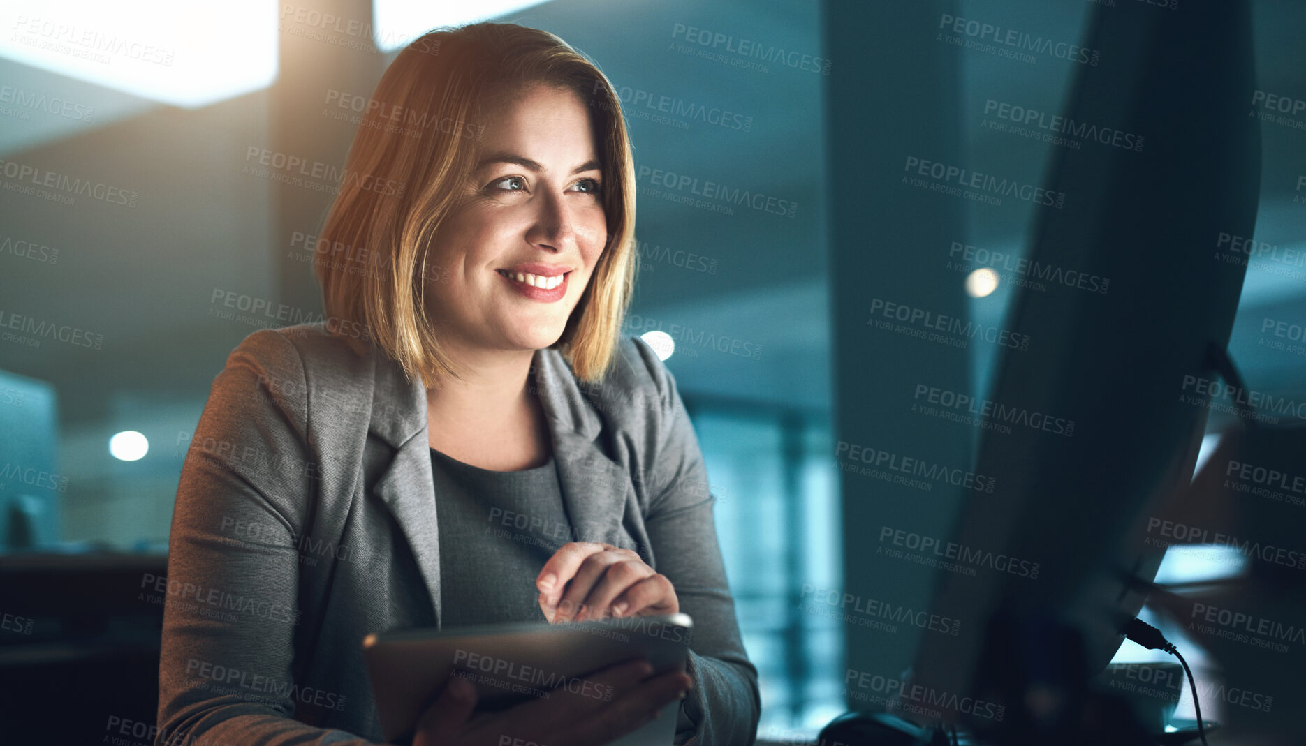 Buy stock photo Cropped shot of a young businesswoman working in her office late at night