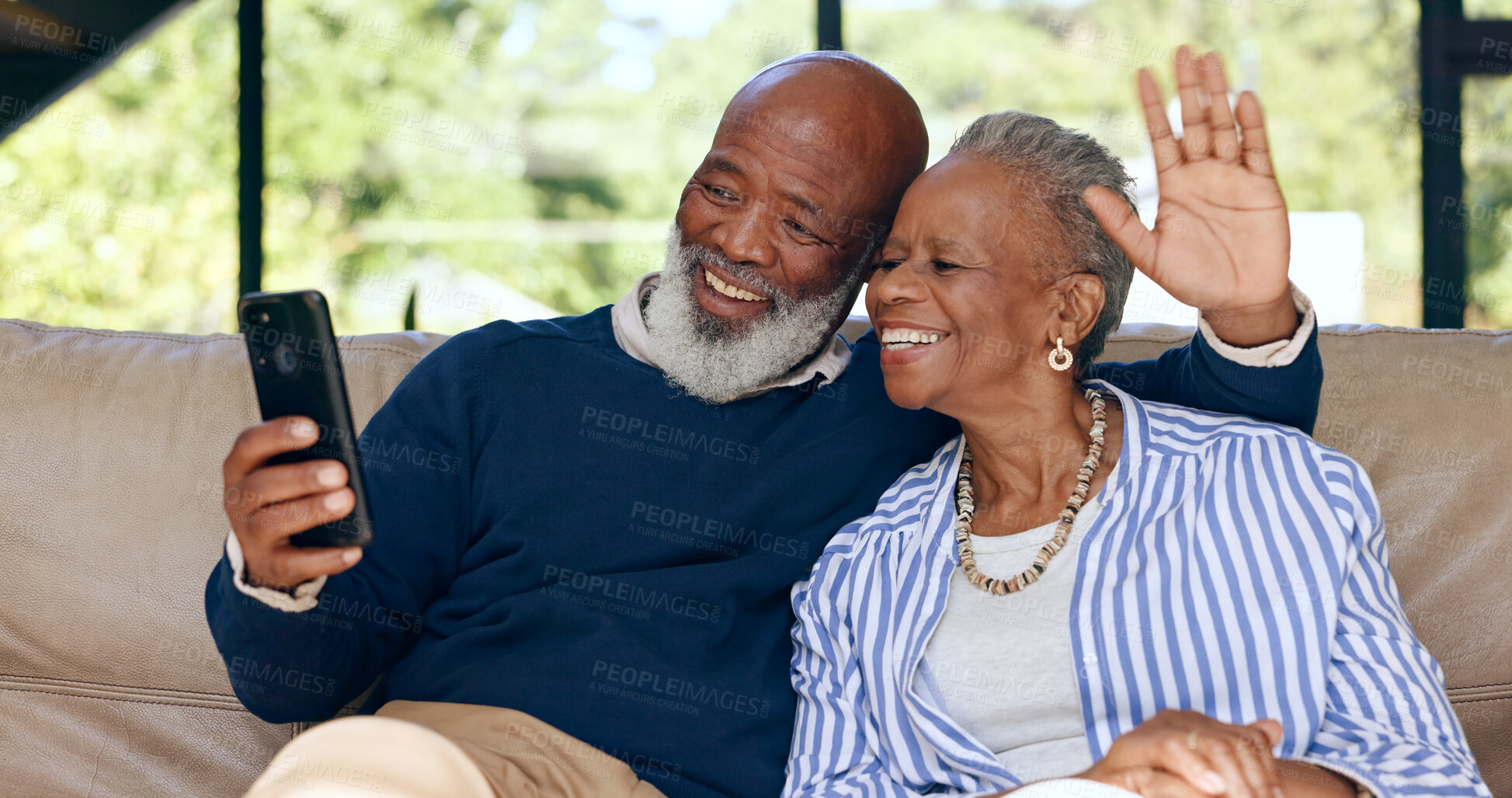 Buy stock photo Video call, happy senior couple and phone in home for voip communication, social network or chat. African man, woman or wave hello on smartphone in virtual conversation, contact or talk in retirement