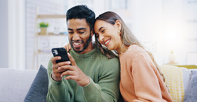 Buy stock photo Couple, living room sofa and texting with phone, smile and click for contact, meme and notification in home. Man, woman and happy with smartphone, reading and app for social network, video and relax