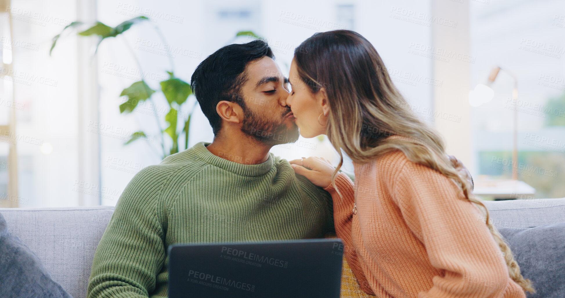 Buy stock photo Couple, love and kiss with laptop on sofa for movies, digital subscription and download multimedia show at home. Happy man, woman and relax at computer for affection, online shopping and connection 